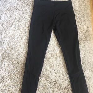 black leggings with mesh bottoms.